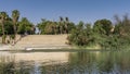 The bank of the Nile is fortified with a stone wall.