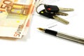 Bank notes, keys and a gold-nibbed pen Royalty Free Stock Photo