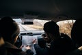 Bank robbers,planning their next hit while holding a gun and counting on a stop watch the time they need to get from one point on Royalty Free Stock Photo