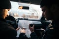 Bank robbers,planning their next hit while holding a gun and counting on a stop watch the time they need to get from one point on Royalty Free Stock Photo