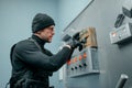 Robber in uniform trying to mines the vault door Royalty Free Stock Photo