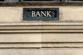 Bank sign painted on letterbox in wall