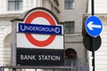 Bank Station Underground roundel with blue traffic arrow sign