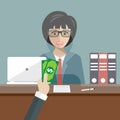 Bank teller sitting behind glass. Woman clerk in a bank office receiving money. Flat vector Royalty Free Stock Photo