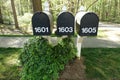 A Bank of Three Black Identical Mailboxes