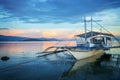 Banka, traditional filipino fishing boat at sunset, Cebu island, The Philippines
