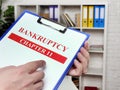 Banker reads the chapter 11 of the bankruptcy law.