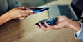 Banking, buying and paying with phone by scanning chip on checkout, wireless and ecommerce machine. Closeup hands of Royalty Free Stock Photo