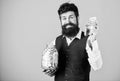 Banking concept. Man bearded guy hold jar full of cash savings. Safe place to keep money. Personal accountant Royalty Free Stock Photo