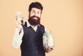 Banking concept. Man bearded guy hold jar full of cash savings. Safe place to keep money. Personal accountant Royalty Free Stock Photo