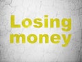 Banking concept: Losing Money on wall background Royalty Free Stock Photo