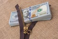 Banknote bundle of US dollar and brown zipper Royalty Free Stock Photo