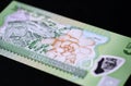 Banknote five Fijian dollars on a dark background Royalty Free Stock Photo