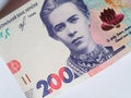 Banknote of 200 hryvnia, close-up. Portrait of poetess Lesya Ukrainka