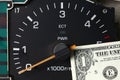 Banknote put tachometer gauge scene. Royalty Free Stock Photo