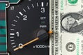 Banknote put tachometer gauge scene. Royalty Free Stock Photo