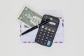 Banknotes in airmail envelope and black pen with calculator on white background Royalty Free Stock Photo