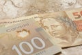 Banknotes of canadian currency: Dollar and brazilian Currency: R