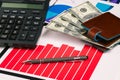 Banknotes, charts and a pen on the office table. Financial indicators of profit growth. Company statistics, research and