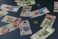 Banknotes of different denominations of Mexican currency, scattered on a blue superfice Royalty Free Stock Photo
