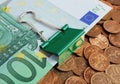 Banknotes euros on coins Royalty Free Stock Photo