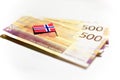 Banknotes in 500 NOK and norwegian flag. Royalty Free Stock Photo