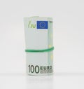 Banknotes one hundred 100 euros in a roll with an elastic band. European currency to save. Close-up, white background. The concept Royalty Free Stock Photo