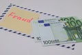 Banknotes in a postal envelope. Fraud concept. Financial fraud. Close-up. Sticker labeled scam.