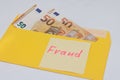 Banknotes in a yellow envelope. Fraud concept. Financial fraud. Close-up. Sticker labeled scam.