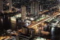 Bankok skyline by night highway and river traffic