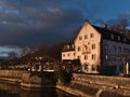 Bankrupt hotel Wilder Mann on shore of Lake Constance in historic building constructed around 1630 in afternoon sun in winter.