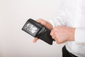 Bankruptcy - Business Person holding an empty wallet. Man showing  the inconsistency and lack of money and not able to pay the Royalty Free Stock Photo