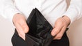 Bankruptcy - Business Person holding an empty wallet. Man showing  the inconsistency and lack of money and not able to pay the Royalty Free Stock Photo