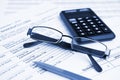 Bankruptcy concept. Close-up pen, calculator and glasses at financial report. Royalty Free Stock Photo