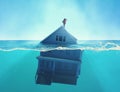 House sinking into the ocean . Half splitted image in the sea of a home floating Royalty Free Stock Photo