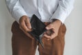 Bankruptcy economic financial concept. Person open his empty wallet without money to pay debt in payday Royalty Free Stock Photo