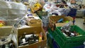 Bankruptcy and liquidation of supermarket. Retail industry. Huge pile of boxes with food and bottle on dirty floor in store. Messy