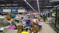 Bankruptcy and liquidation of supermarket. Retail industry. Huge pile of cardboard boxes with food on dirty floor in store. Messy.