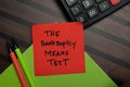 The Bankruptcy Means Test write on sticky notes isolated on Wooden Table