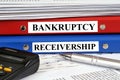 Bankruptcy and receivership files stacked on a desk in close-up Royalty Free Stock Photo