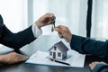 Banks approve loans to buy homes. Real estate agents explain the document for customers who come to contact to buy a house, buy or Royalty Free Stock Photo