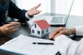 Banks approve loans to buy homes. Real estate agents explain the document for customers who come to contact to buy a house, buy or Royalty Free Stock Photo