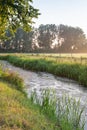 Banks of a ditch in early morning light Royalty Free Stock Photo