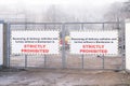 Banksman required for reversing of vehicles sign at gate entrance on building construction site and strictly prohibited text Royalty Free Stock Photo