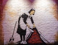 Banksy, `English Maid` or `Sweep It Under The Carpet Maid` 2006, art by Banksy, anonymous English street graffiti artist