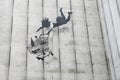 Banksy falling shopper graffiti