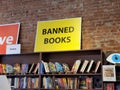 Banned Books sign above book titles on shelf Royalty Free Stock Photo