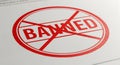 BANNED word in red stamp on white textured paper Royalty Free Stock Photo