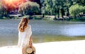 Banner with a beautiful brunette girl with curls walks on the beach. Royalty Free Stock Photo