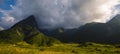 Banner Beautiful landscape mountain green field grass meadow white cloud blue sky on sunny day. panoramic Majestic green scenery Royalty Free Stock Photo